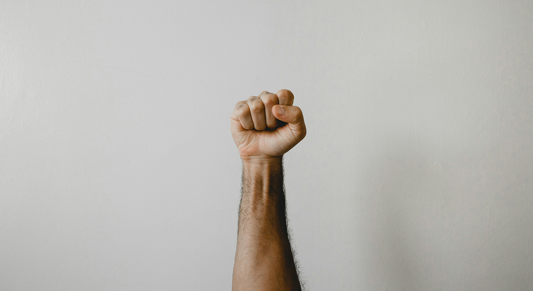 Raised fist. Raised fist.