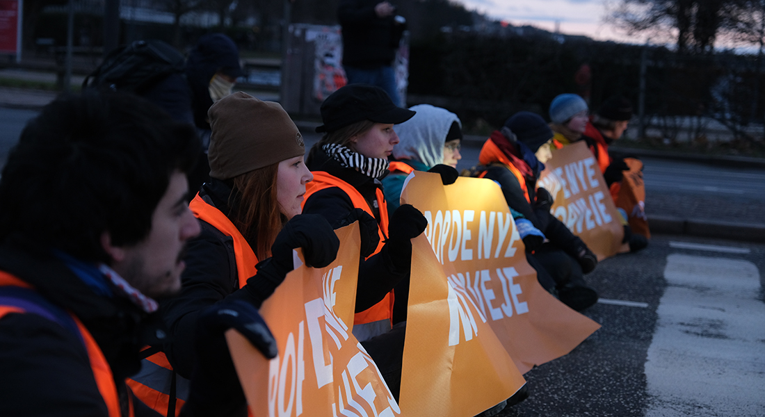 Climate activists holding a banner.