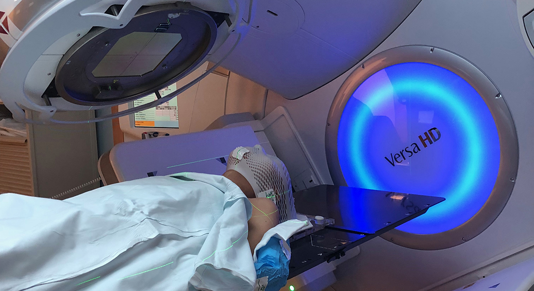 Woman receiving radiotherapy.